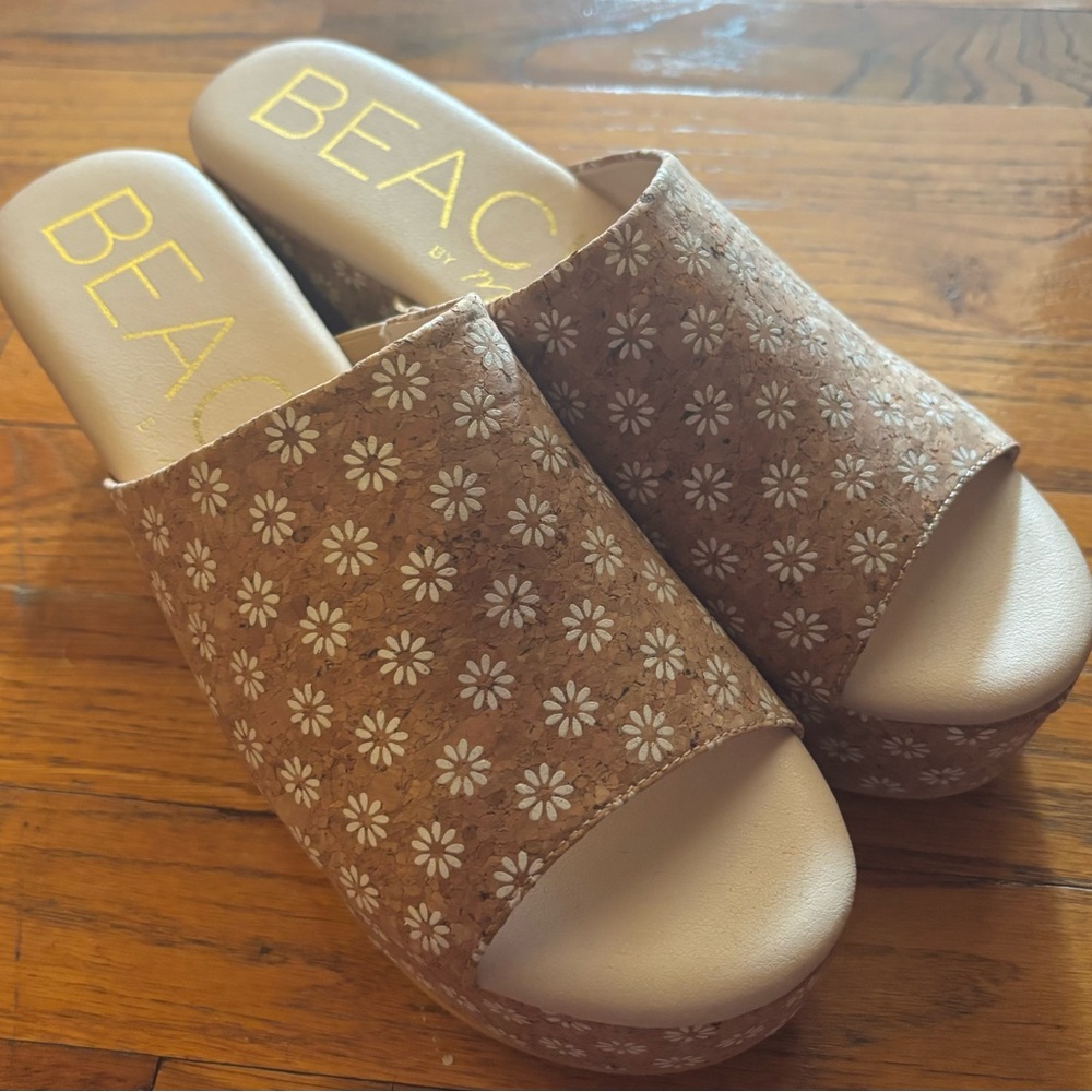 Platform sandals with floral designs. Women’s size 10